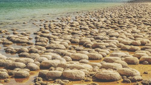 Stones in sand at beach