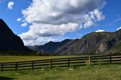 Scenic view of landscape and mountains against sky