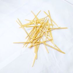 High angle view of bread on table against white background