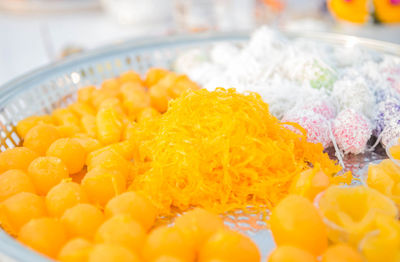 High angle view of multi colored candies in plate