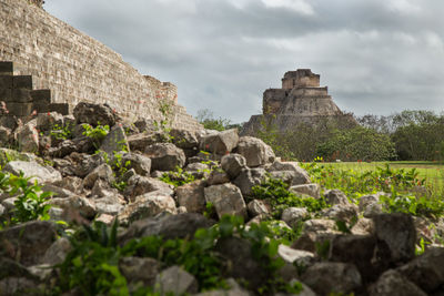 View of old ruins against cloudy sky