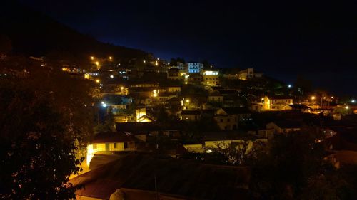 High angle view of illuminated buildings in city at night