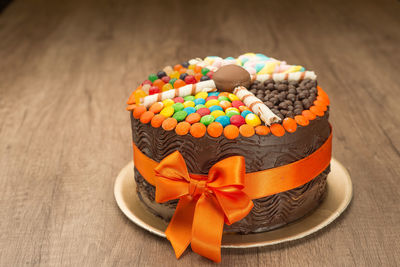 Close-up of birthday cake on wooden table