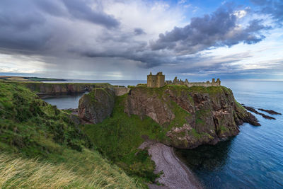 Dunnottar castle by sea on cliff