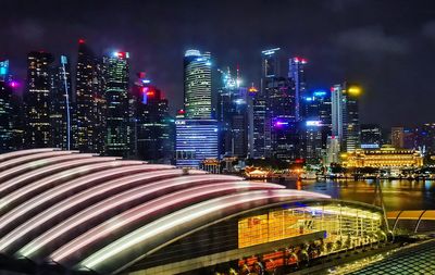 Illuminated modern buildings in city at night