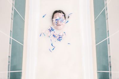 Directly above shot of woman having milk bath