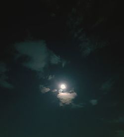 Low angle view of moon in sky at night