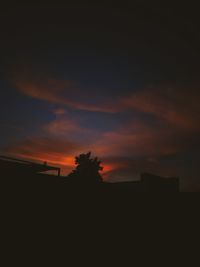 Silhouette of building at sunset