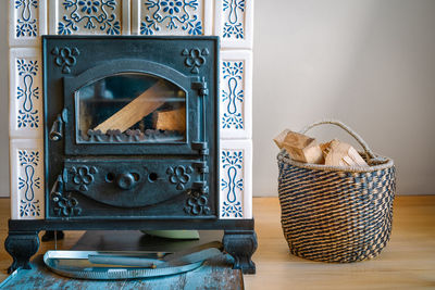 Firewood basket by fireplace