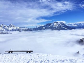 Scenic view of snowcapped mountains against sky