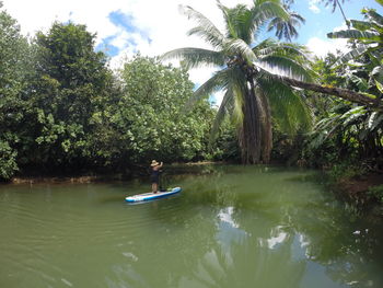 Man rowing boat in lake