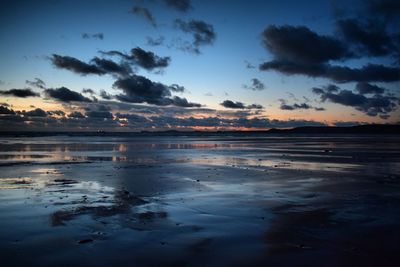 Scenic view of sea against sky at sunset