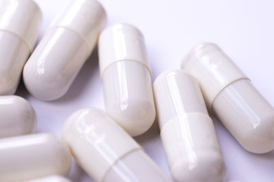 Close-up of capsules on white background