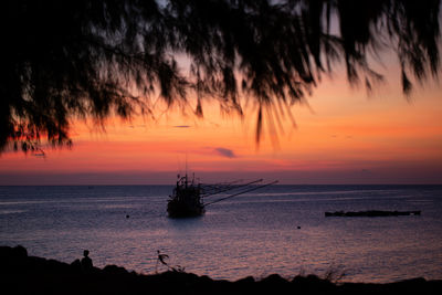 Scenic view of sea against orange sky