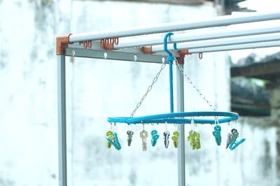 Close-up of clothespins hanging on clothesline