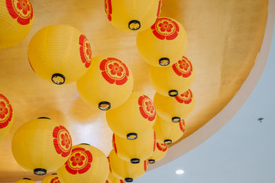 Low angle view of lanterns hanging on ceiling