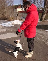 Man with dog on snow