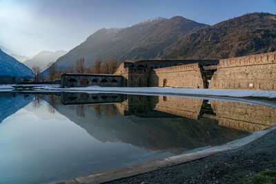 Scenic view of lake and mountains against sky