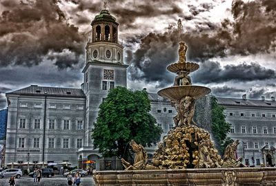 Low angle view of statue against cloudy sky