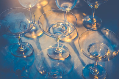 Close-up of wine glasses on table