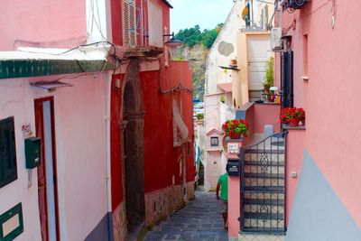 Narrow alley amidst buildings in city