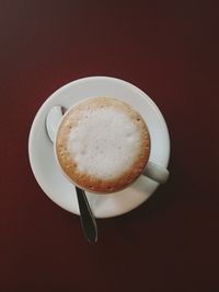 High angle view of cappuccino served on table