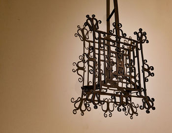 Close-up of chain against wall