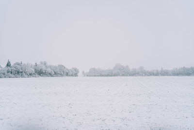 Scenic view of snow field against clear sky