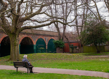 Man sitting on bench in park