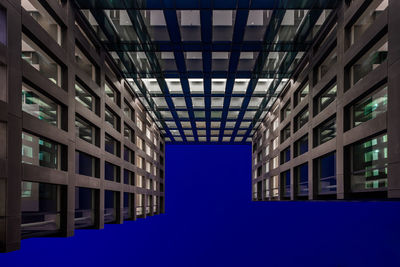 Low angle view of buildings against blue sky