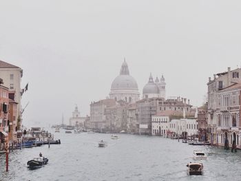 Santa maria della salute by canal against sky