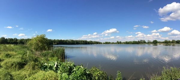 Scenic view of lake against blue sky