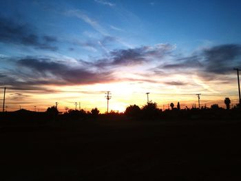 Silhouette of landscape against dramatic sky