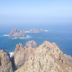 Scenic view of sea against blue sky