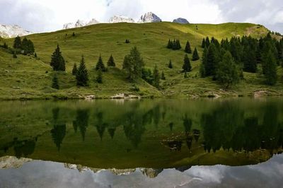 Scenic view of lake with mountains in background