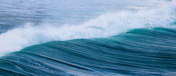 Close-up of wave splashing on sea