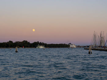 Scenic view of sea against clear sky during sunset