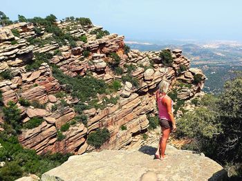 Full length of person on rock against sky