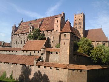 Low angle view of old building against sky