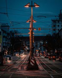 Street lights in city at dusk