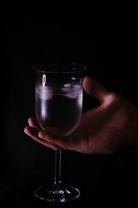 Cropped image of person holding wineglass