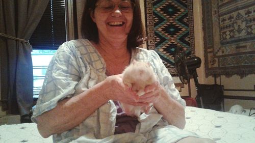Midsection of man sitting at home