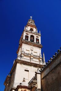 Low angle view of building against blue sky