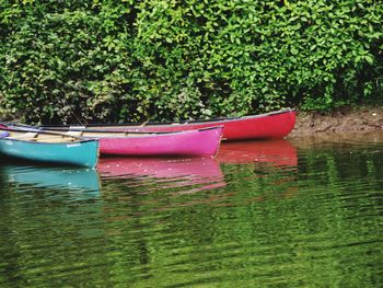 Boats moored in lake