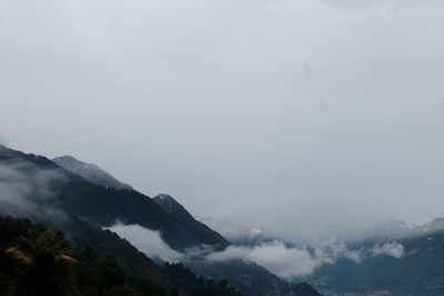 Scenic view of mountains against sky during winter