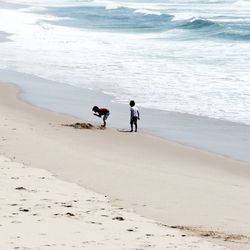 People walking on beach