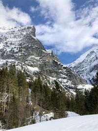 Scenic view of snowcapped mountains against sky