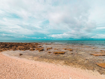 Scenic view of beach against sky