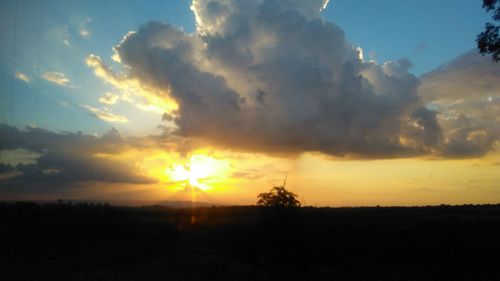 Silhouette landscape against sky during sunset