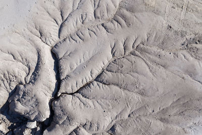 Aerial shot of abandoned opencast mine. abstract cracked mud pattern, erosion, bad land from a drone